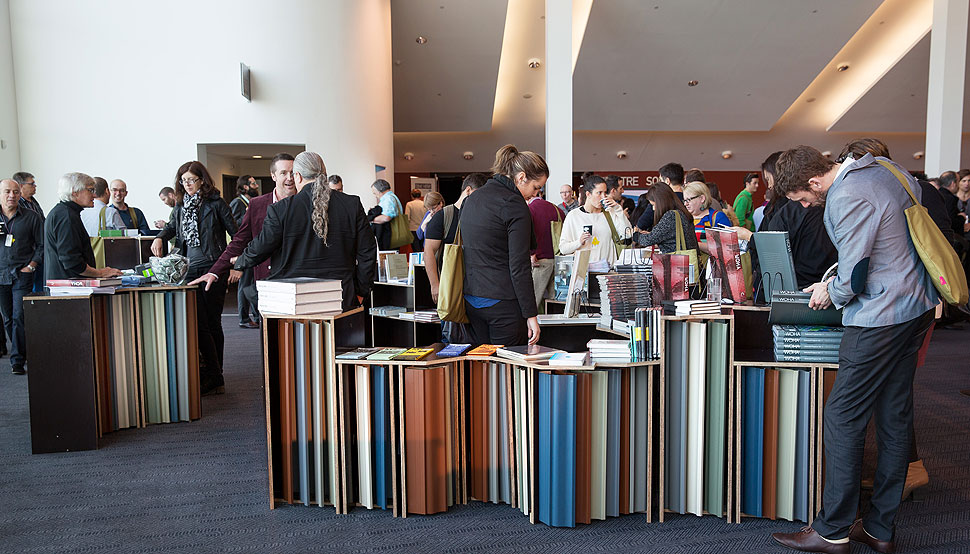 The winning entry, constructed in the foyer of Perth's Convention and Exhibition centre, was inspired by an aerial photograph of Kalgoorlie's Super Pit, Australia's largest open cut gold mine, which was inverted to provide the contours for the shelving and shape of the pop-up book shop.